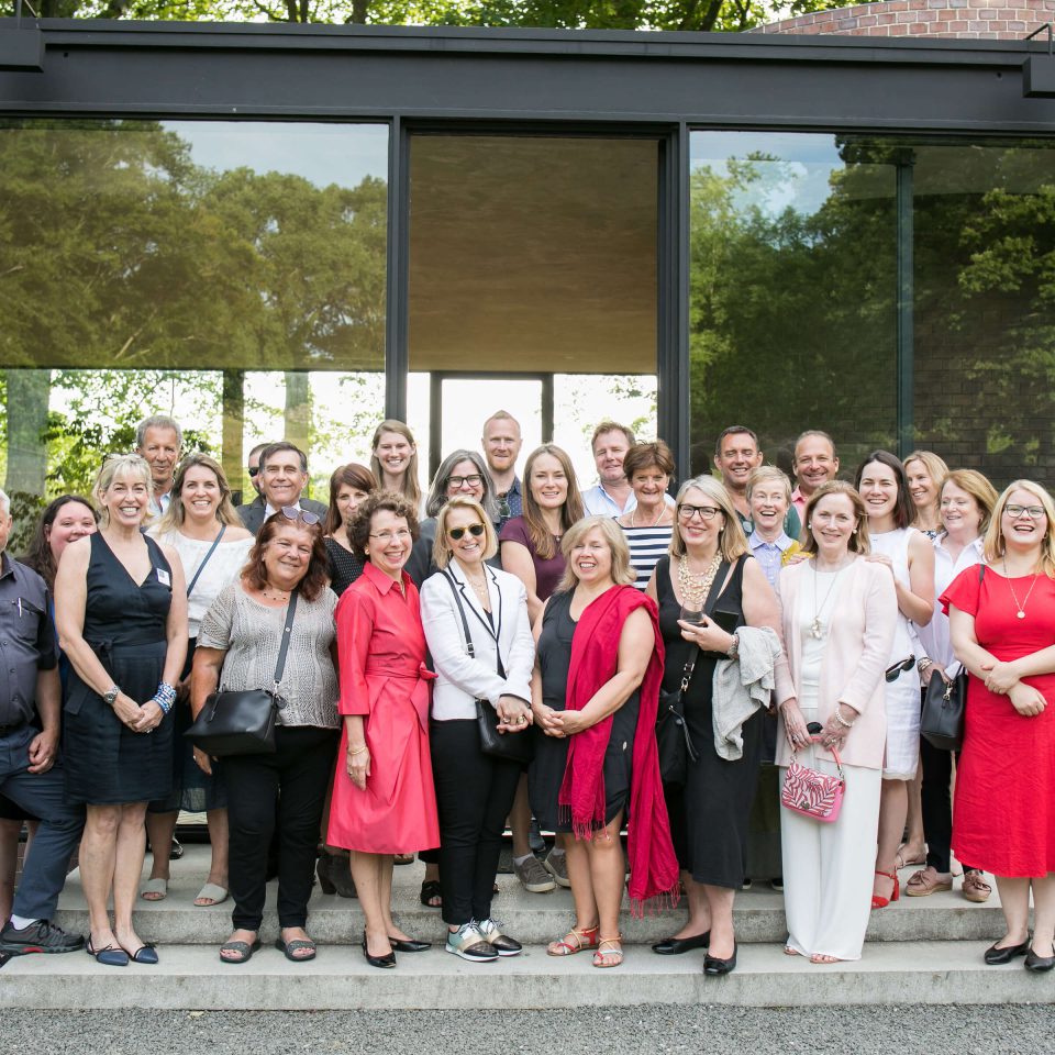 Who we are: INTO Team of trustees staff and supporters at the Glass House in New York state, USA