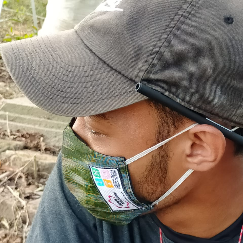 Conservation worker in Indonesia uses a mask provided by a TAP-INTO covid grant