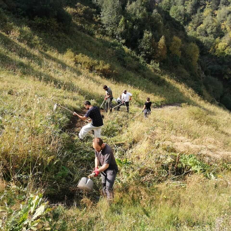 Volunteers clear a new walking trail from site to the upper level of Mount Sairme.
