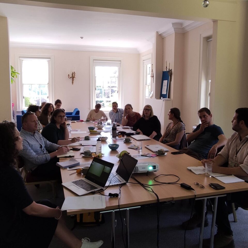 a large European exchange group meeting around a table