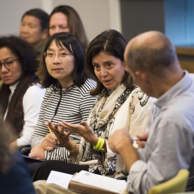 ASK INTO programme participants talking in a group