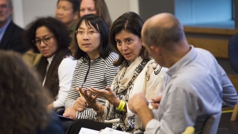 ASK INTO programme participants talking in a group