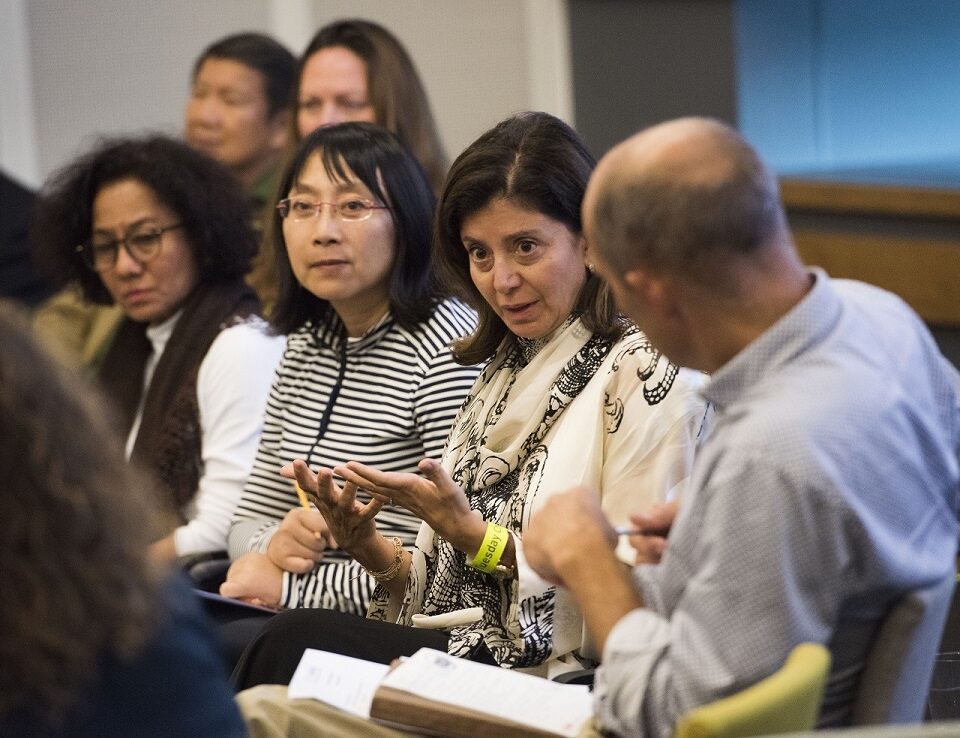 ASK INTO programme participants talking in a group