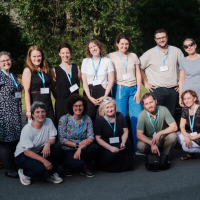 a group of people smiling at the camera at 10 years event