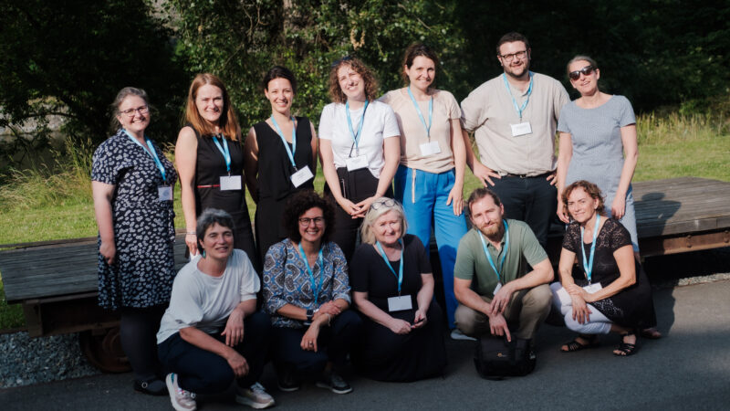 a group of people smiling at the camera at 10 years event