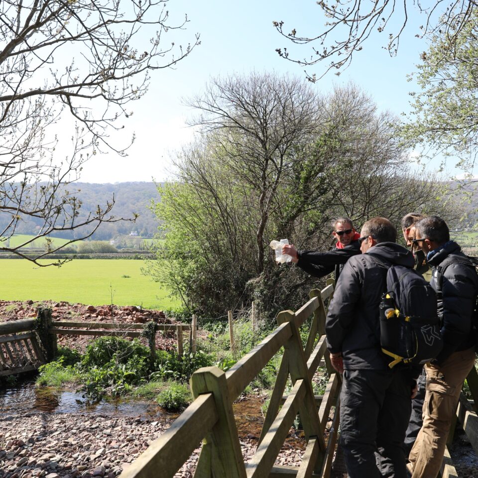 TAP INTO visiting rangers on a bridge over a path