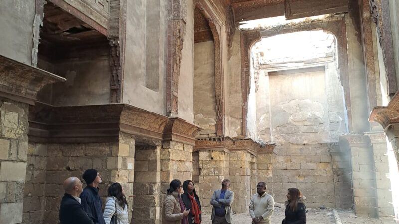 a group of people looking up at ornate ceilings in an historic building in Cairo Egypt