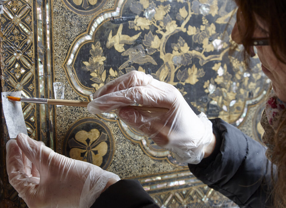 Conservation work on Japanese chest at Chirk Castle, Wrexham, Wales. This shark-skin covered chest opens to reveal a black lacquered interior in-laid with a mother of pearl panther. The chest is thought to have been acquired by Sir Thomas Myddelton I, who made his fortune as a merchant adventurer and was one of the founders of the East India company.