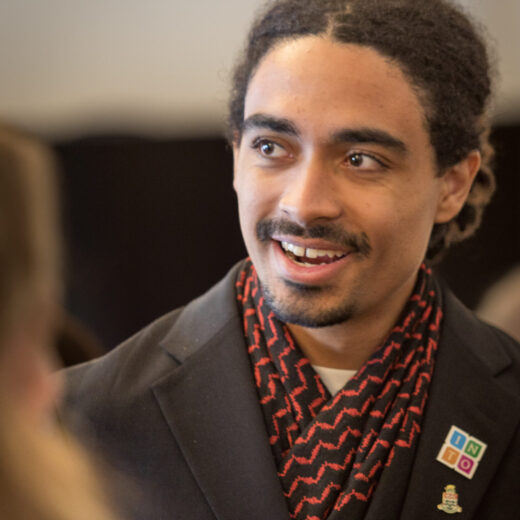 a young Caymanian man in conversation with someone off camera