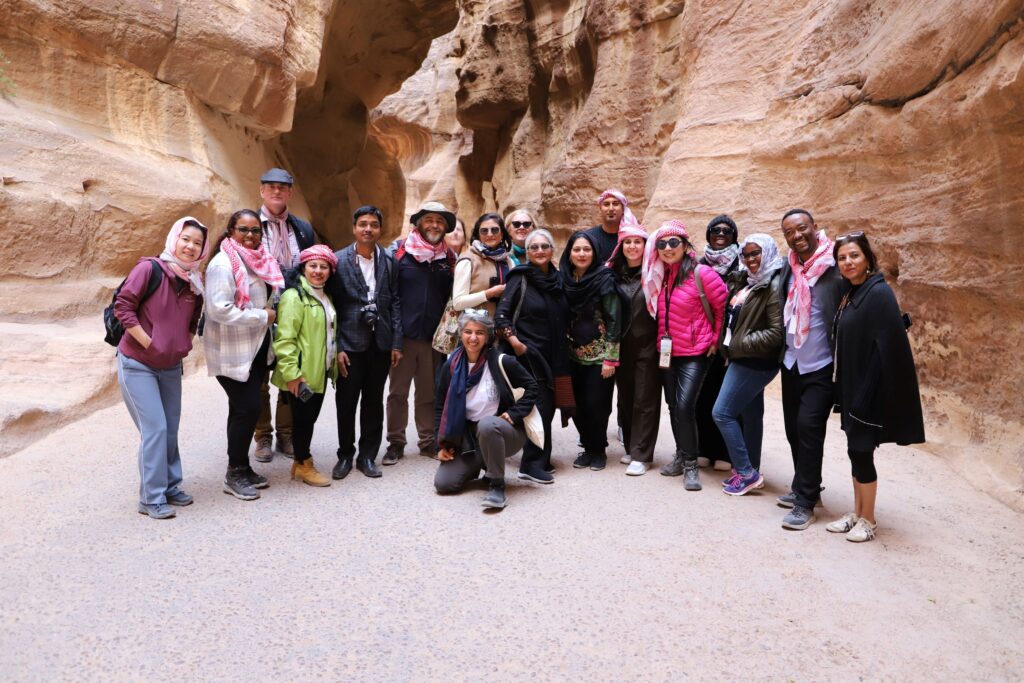 a group of people in a red stone gorge in Petra, Jordan for the newsletter - subscribe now