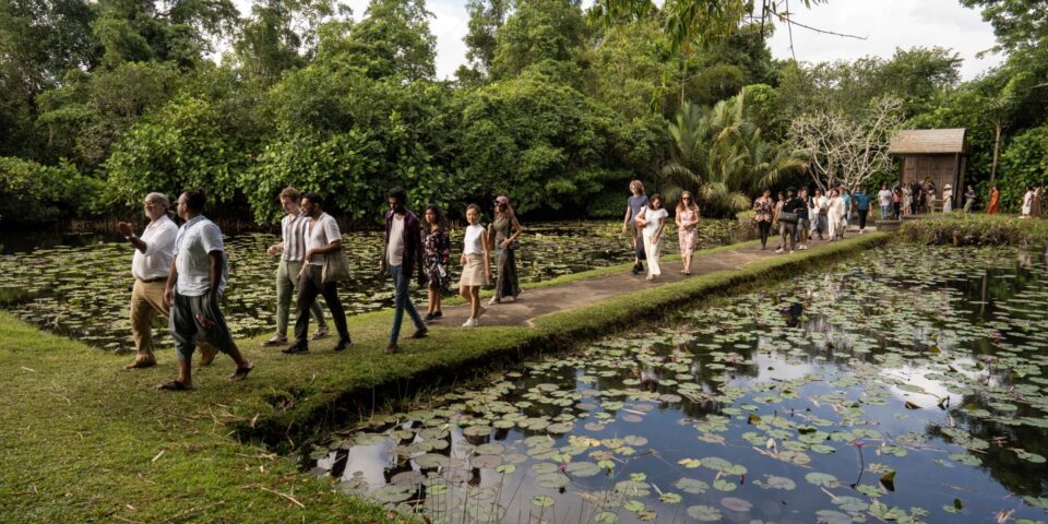 People walking in a tropical garden