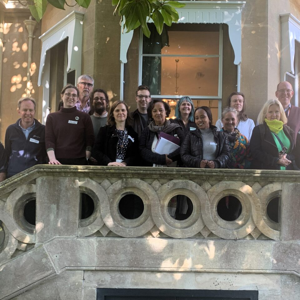 a group of people on the balcony of Fairfield House in Bath