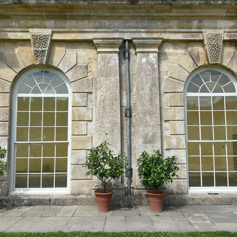 two huge windows on the facade of an historic house