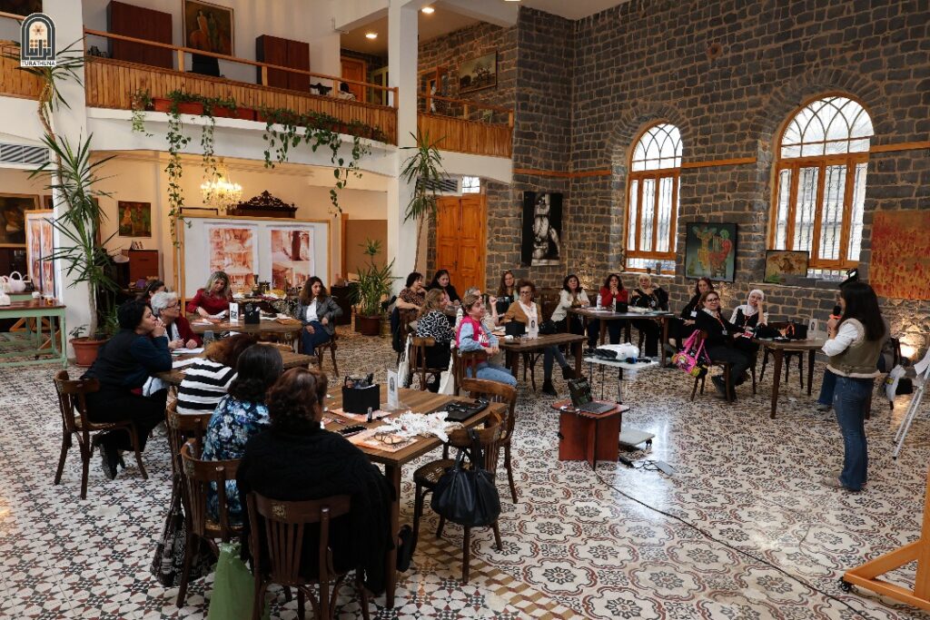 a group of women at a workshop inside the Ghassania Theatre in Homs