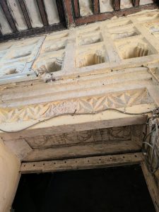 interior of a traditional building on the Comoros islands with elaborate plaster work and niches with arches