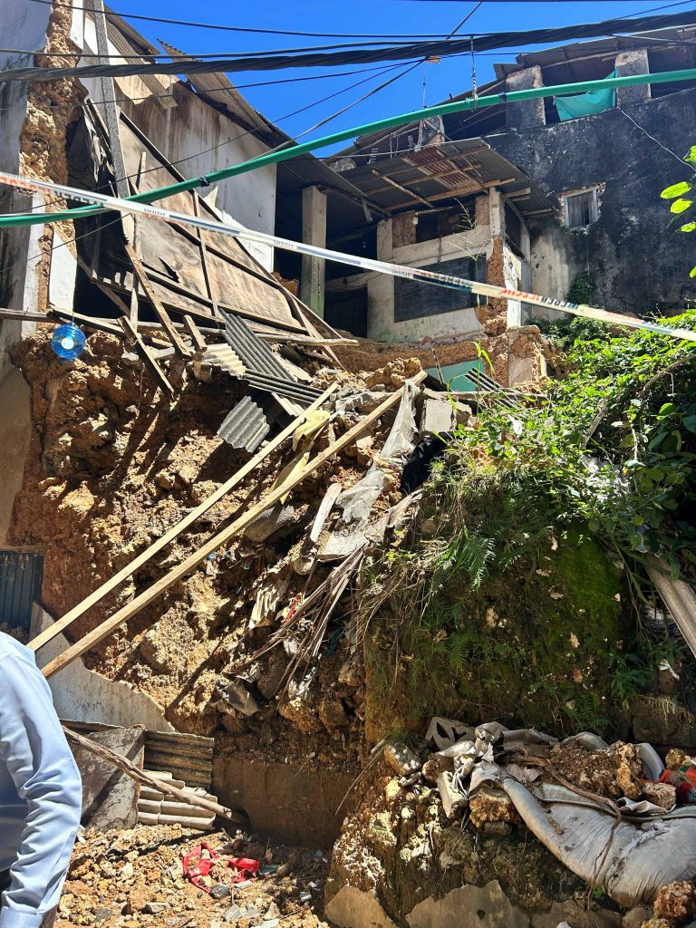 a view of rubble and corrugated iron roof from a collapsed building in Stone Town Zanibar