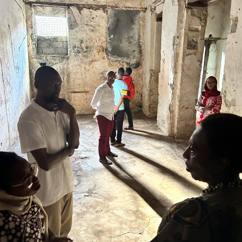 a group of people inside the Swaniani Princely House in the Comoros